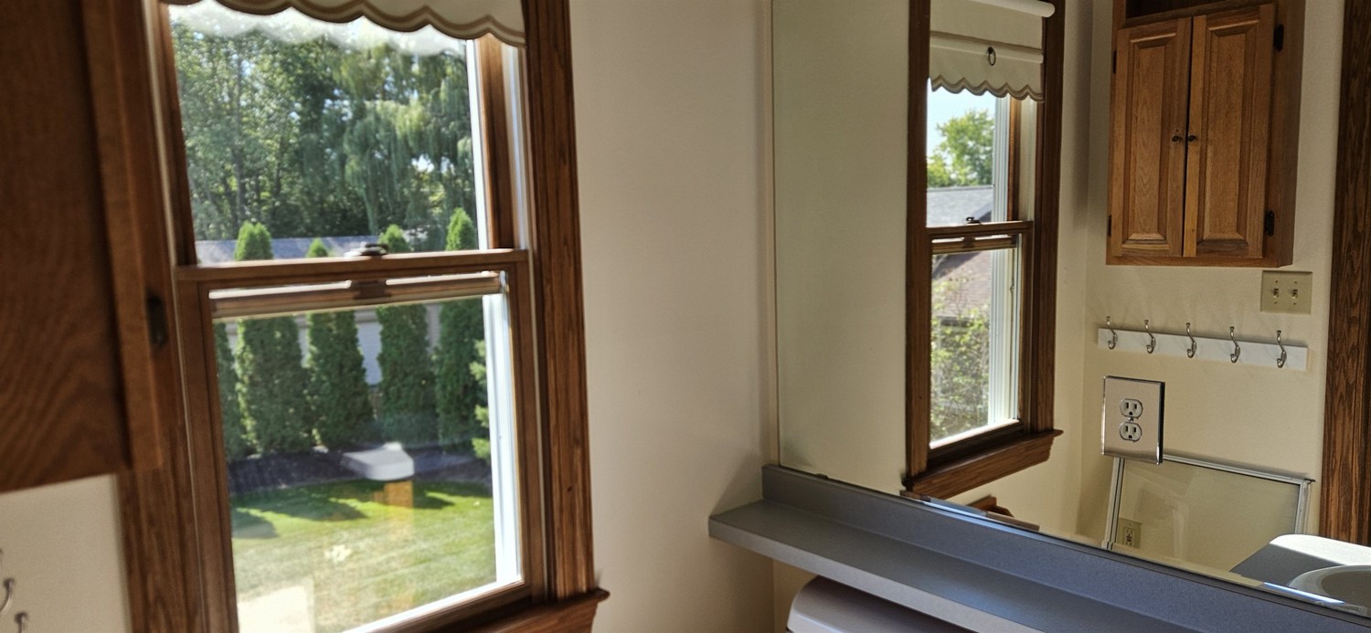 Window cleaning technician at a residential job
