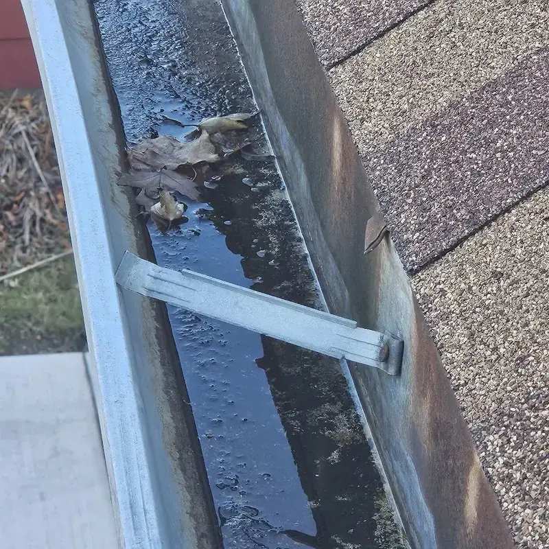 Damaged gutter hanger that needs repair