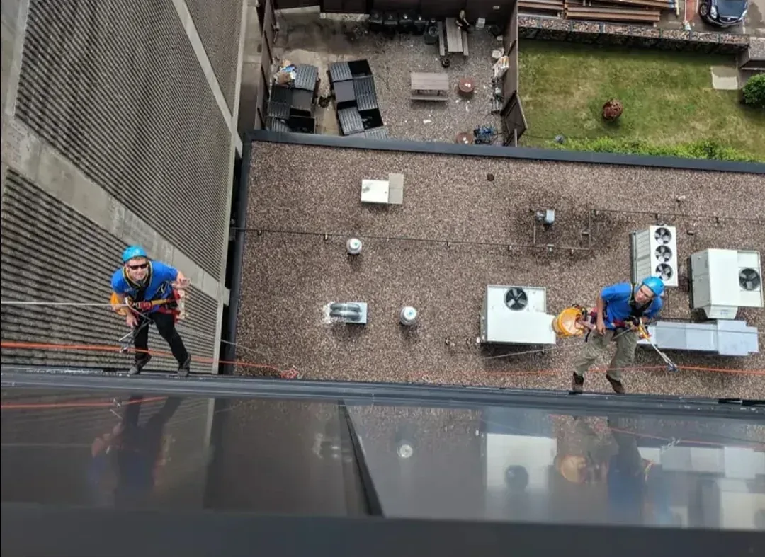 High-rise commercial window cleaning in progress